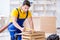 Repairman carpenter working sawing a wooden board with a hand sa