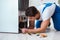 The repairman contractor repairing fridge in diy concept