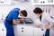 Repairman Fixing Induction Stove In The Kitchen