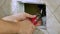 Repairman hands using wrench to close tap flush toilet box to fix bathroom closeup video
