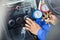 Repairman holding monitor tool to check and fixed car air conditioner system, Technician check car air conditioning system