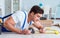 Repairman laying laminate flooring at home