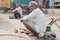 Repairmen on the street in Delhi, India