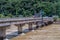 Repairmen working on bridge damaged by flood water