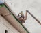 Reparation or installation of roof rain gutter in a lift basket crane  in Panama's Casco Viejo