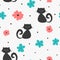 Repeated abstract silhouettes of cats, flowers and polka dots. Cute seamless pattern for children.