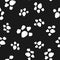 Repeated footprints of pets. Cute seamless pattern for animals.