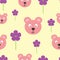 Repeated heads of funny bears and flowers with hearts. Cartoon seamless pattern.