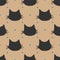 Repeated silhouettes of cat`s heads. Polka dot. Seamless pattern.
