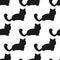 Repeating black silhouettes of cats on a white background. Seamless pattern.