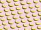 Repeating object background of bright yellow bananas