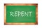 REPENT text written on green school board