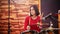 Repetition. Girl in red sweater fervently plays the drums in a studio.