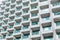 Repetitive pattern of concrete corridors with green glass of hotel at Dubai