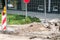 Replacement of the paving tiles or cobblestone bricks of the pedestrian sidewalk in the city with construction safety metal barrie