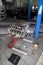 Replacement used engine mounted on a crane for installation on a car after a breakdown and repair in a car repair workshop as a