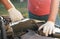 Replacing the battery before winter. Car maintenance before the cold season. Close up hand of Male mechanic changing car battery,