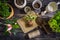 Replanting plants - herbs, flowers and plants in pots, green garden on a balcony