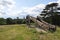 Replica cannon on the earthworks at Basing House with the buildings of Basingstoke in the distance