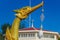 Replica of Royal Barge Suphannahong in the shape of a mythical swan and a crystal ball hanging from its teeth.