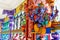 Representation of Hindu gods and tourists climbing a colorful stairs leading to the Batu Caves