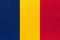 Republic of Chad national fabric flag, textile background. Symbol of world african country
