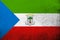 The Republic of Equatorial Guinea National flag with coat of arms. Grunge background