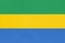 Republic of Gabon national fabric flag, textile background. Symbol of african world country