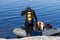 Republic of Karelia, Russia - August 20, 2015: Scuba diver standing near the boat checking equipment and preparing to dive