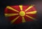 Republic of Macedonia Flag Made of Metallic Brush Paint on Grunge Dark Wall
