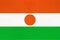 Republic Niger national fabric flag textile background. Symbol of world african country