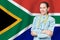 Republic of South Africa healthcare concept with doctor on RSA flag background. Medical insurance, work or study in the country