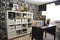 repurposed storage unit, with shelves and bins transformed into chic home office