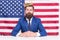 Reputable businessman handsome man sit desk american flag background, american dream concept