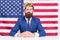 Reputable businessman handsome man sit desk american flag background, big boss concept