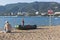 Rescue boat and a sign saying Warning! No swimming! Danger of fatal injury on a beach in Gelendzhik