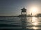 Rescue booth, tower, rescue post on the edge of the pool-infinity water merging with the horizon on the background of the sea in a