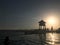 Rescue booth, tower, rescue post on the edge of the water of a luxurious infinity pool merging with the horizon against the backdr