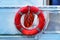 The rescue circle hangs aboard the yacht, a red circle with ropes to save the drowning man