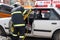 Rescue firefighter in action for saving people from a car crash in front of other people in Sofia, Bulgaria - Sep,11, 2007.