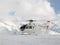 Rescue helicopter on a ski slope in the Alps France