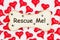 Rescue me message on a wood dog bone with paw print with red hearts on white fabric