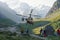 Rescue operation with helicopter in high mountains valley