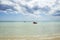 Rescue rowing boat on the sea against a cloudy and sunny sky. Beautiful view. Crystal clear water. Paradise beach