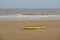 Rescue surfboard on sand beach