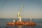 Rescue wrecked oil tanker Delfi in Odessa, Ukraine 26 August 2020, near Black Sea coast. Marine Crane lift wreck Delphi into sea.