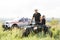 Rescuers on an ATV in the middle of the field, rescue vehicles