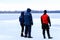 Rescuers in uniform and diving suit are on duty on the frozen river during winter fishing and sport events. Rescue service on the