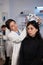 Researcher engineer woman putting eeg scanner on woman patient head
