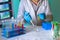 Researcher pipetting sample in tube in the science lab